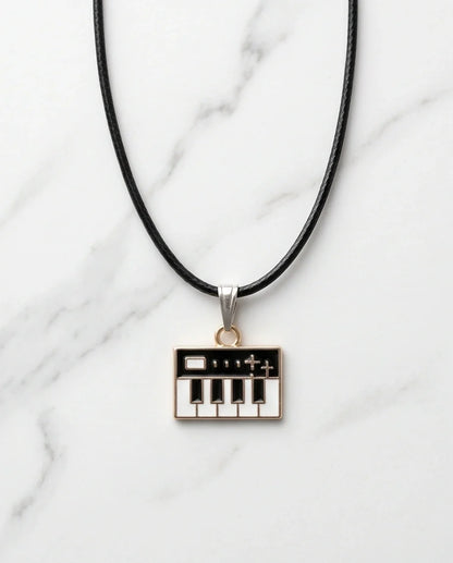 Gold and Black Synthesizer Keyboard Necklace