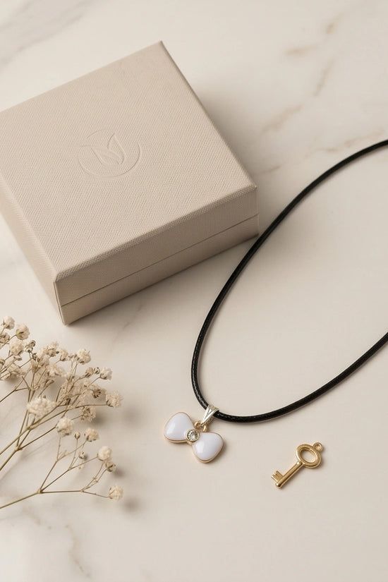 Gold and White Bow Tie Pendant Necklace