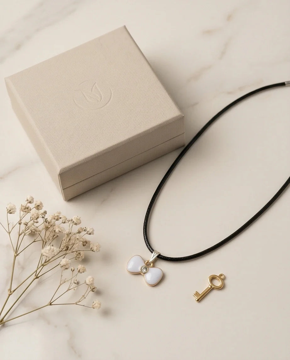 Gold and White Bow Tie Pendant Necklace