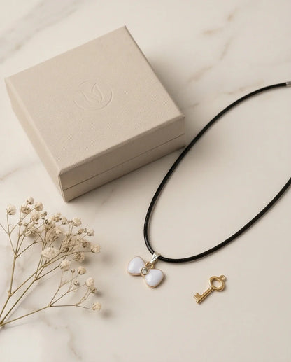 Gold and White Bow Tie Pendant Necklace