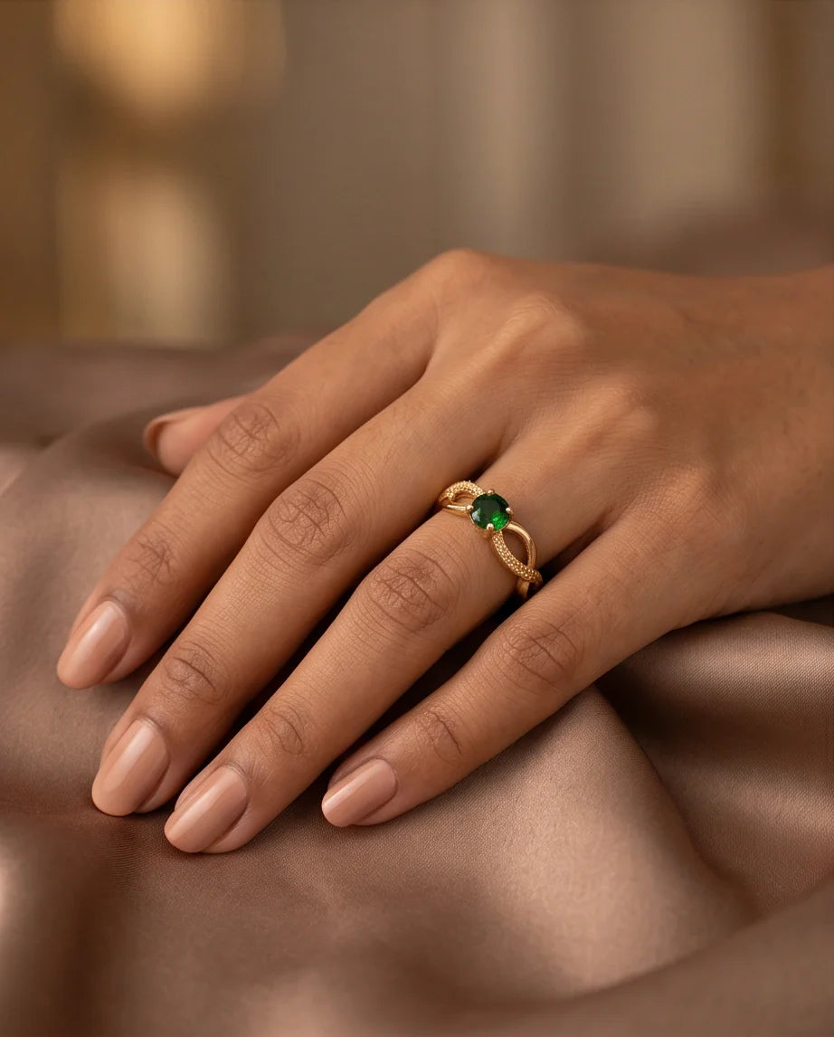Gold Emerald Round Infinity Twist Ring