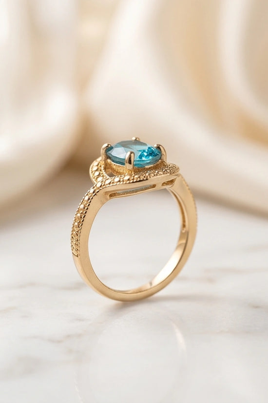 Luxury 14K Gold Oval Swiss Blue Topaz Swirl Halo Ring