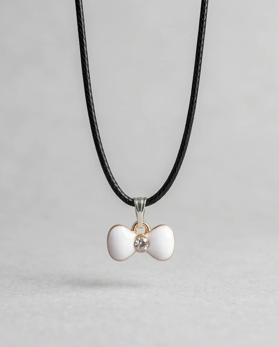 Gold and White Bow Tie Pendant Necklace