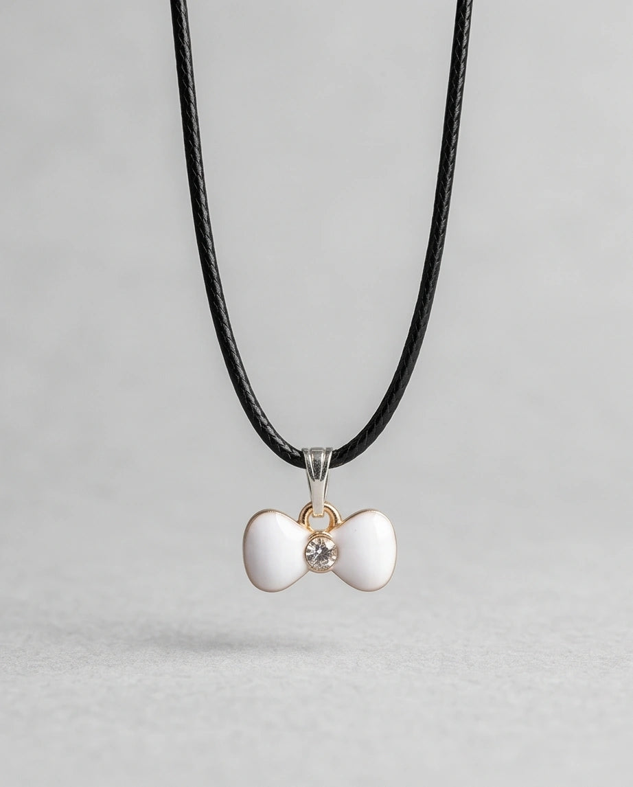 Gold and White Bow Tie Pendant Necklace